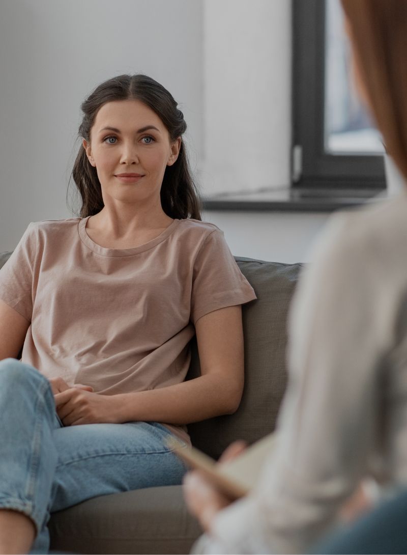 client sitting with therapist